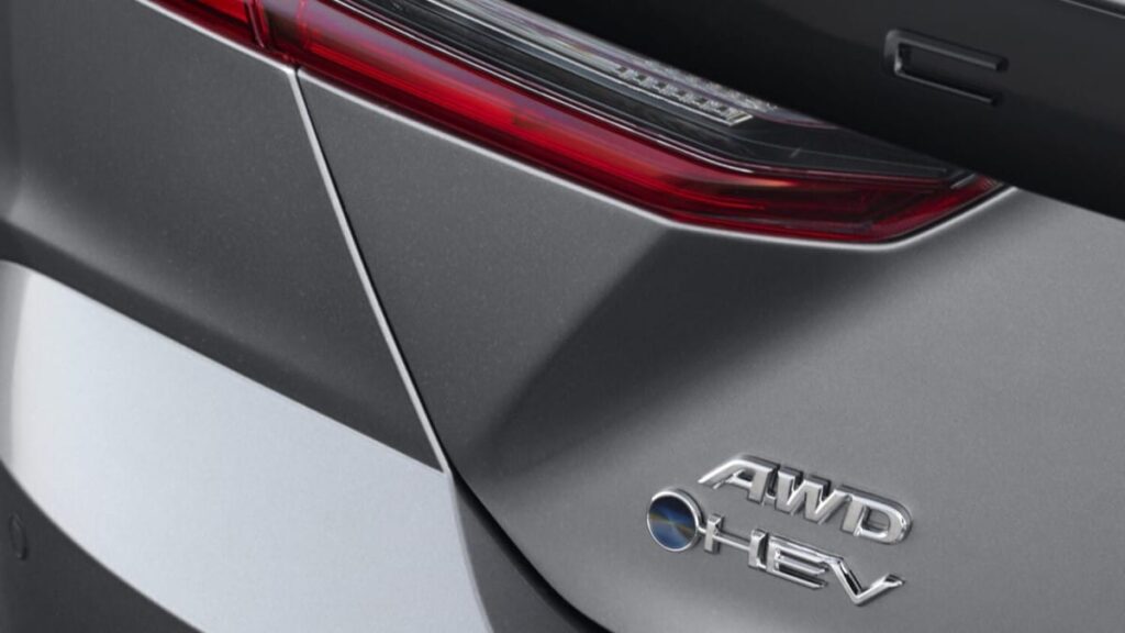 A teaser photo showing trunk badges on the 2025 Toyota Camry