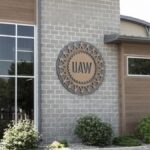 The United Auto Workers union logo on an office building